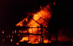 Lightning struck this unprotected building which was completely destroyed. You can see a car burning in the garage